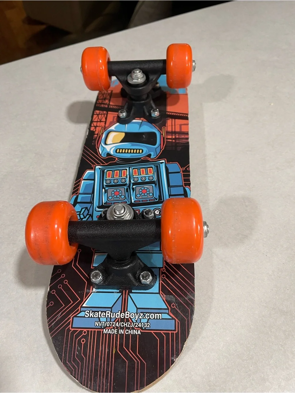SkateRudeBoyz Kids Mini Skateboard - Blue Robot with Orange Wheels